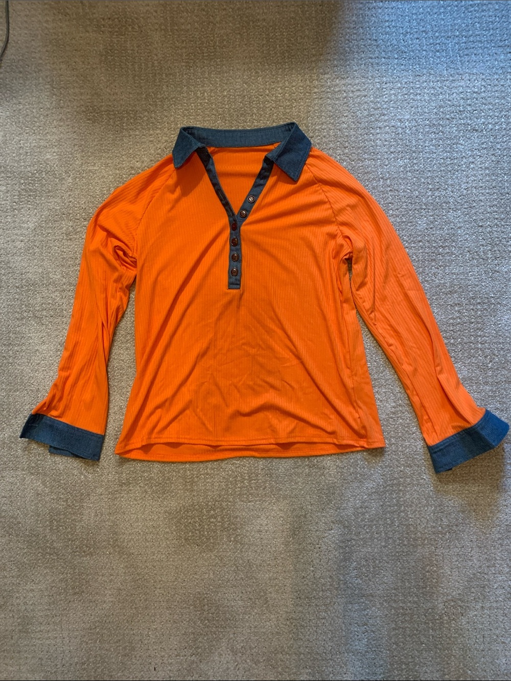 Large orange long-sleeve top with denim
Collar and cuffs